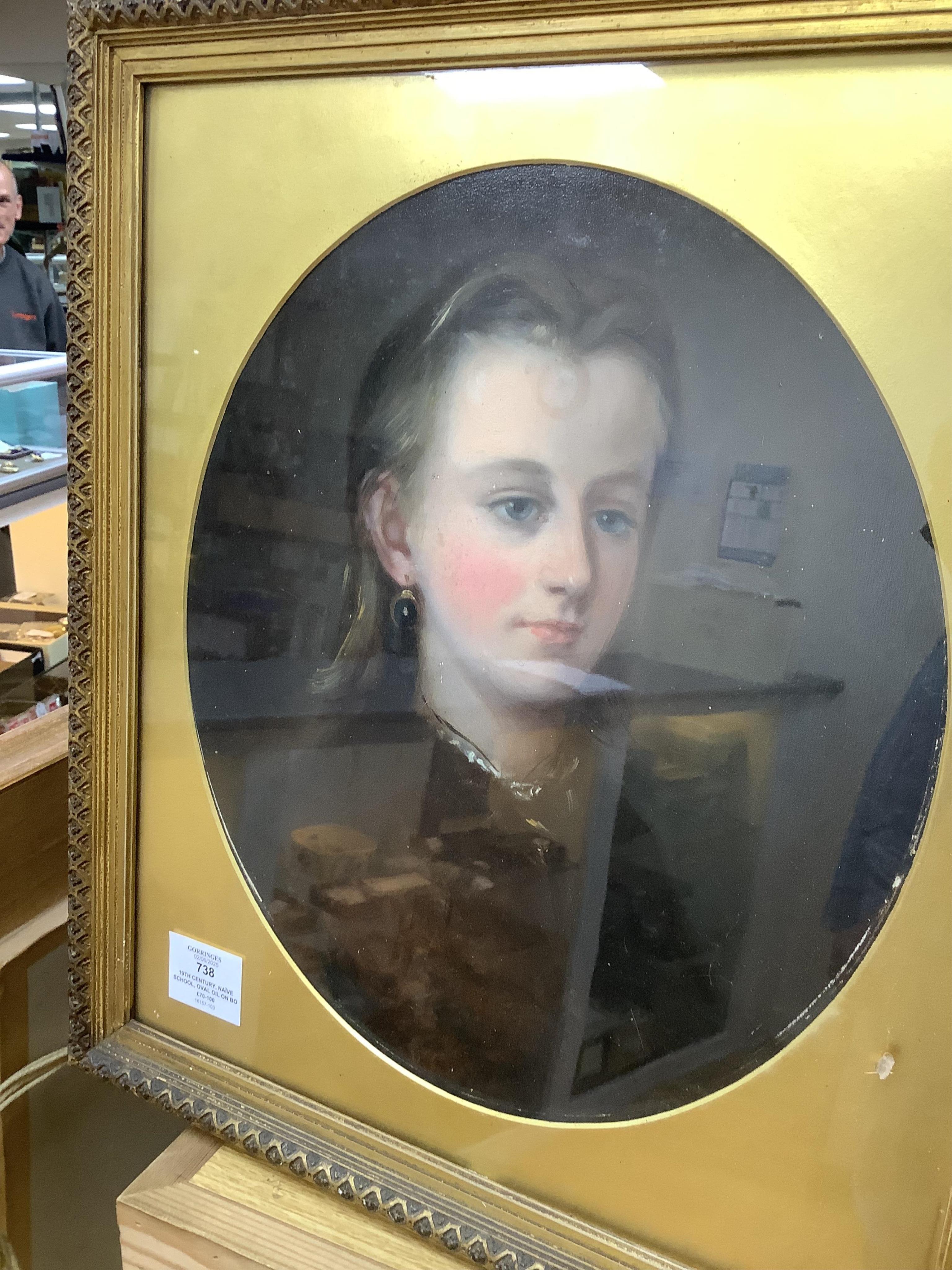 19th century, Naïve school, oval oil on board, three quarter length portrait of a lady, gilt framed, together with a similar portrait of a girl wearing garnet earrings, largest 34 x 24cm